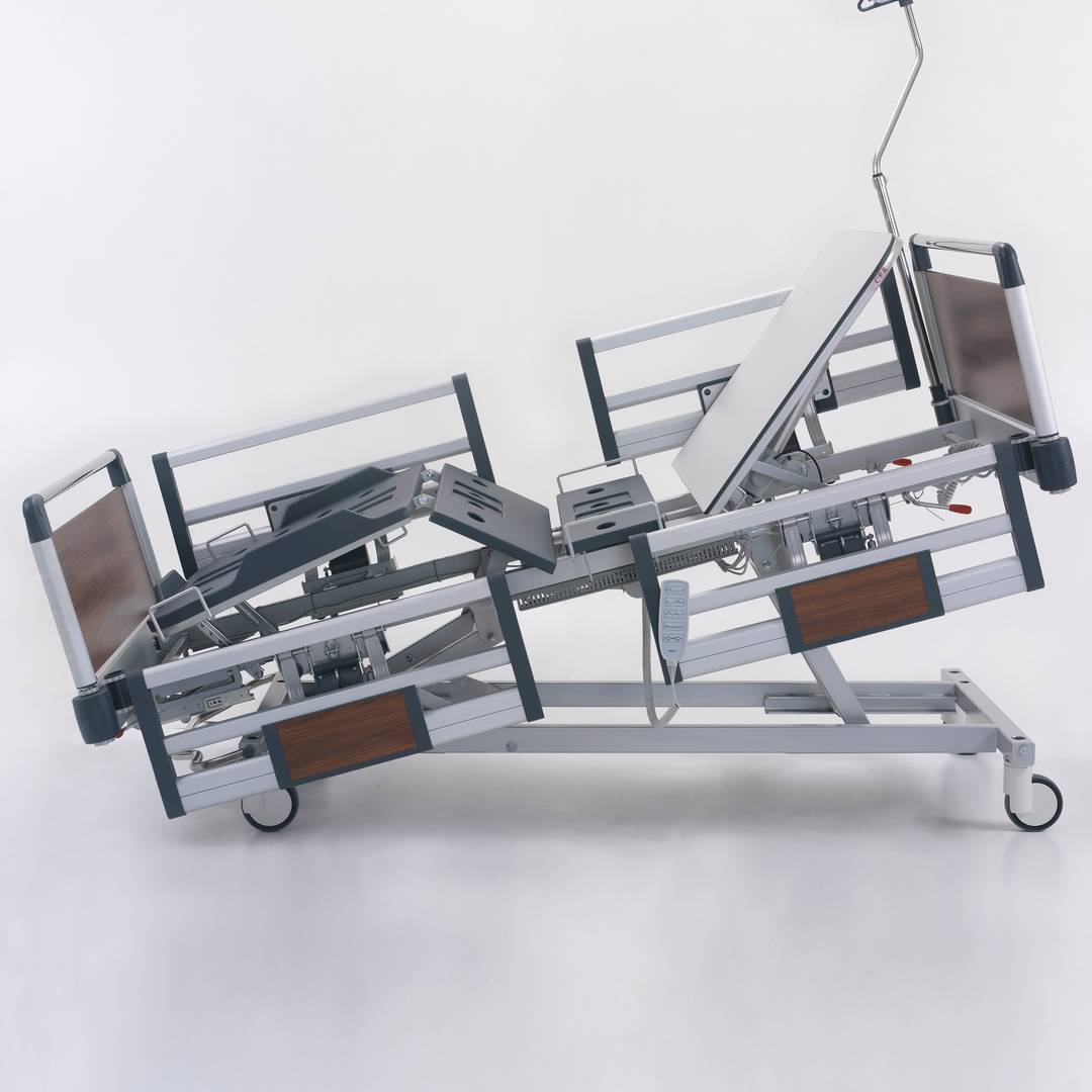 Four motor Nitrocare HB 4230 patient hospital bed with ABS lying surface