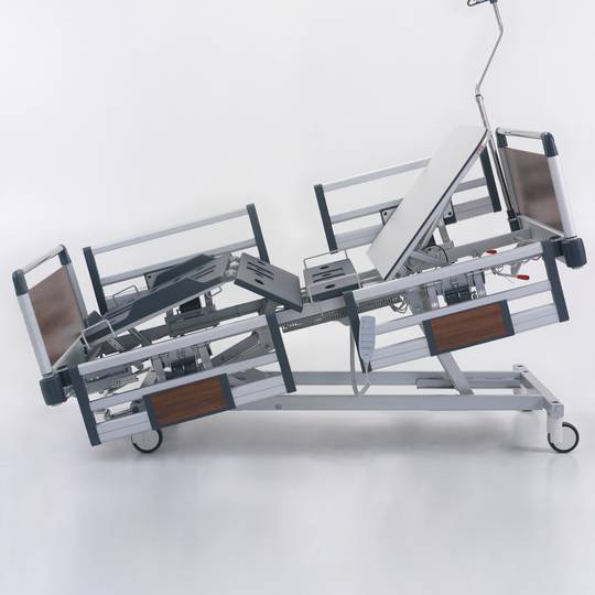 Four motor Nitrocare HB 4230 patient hospital bed with ABS lying surface
