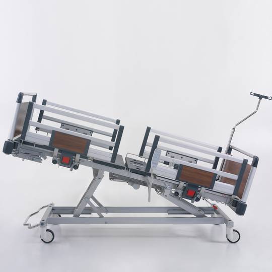 Four motor Nitrocare HB 4230 patient hospital bed with ABS lying surface