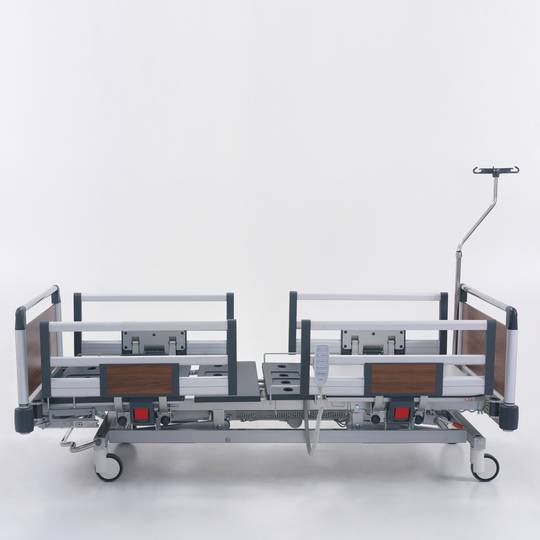 Four motor Nitrocare HB 4230 patient hospital bed with ABS lying surface