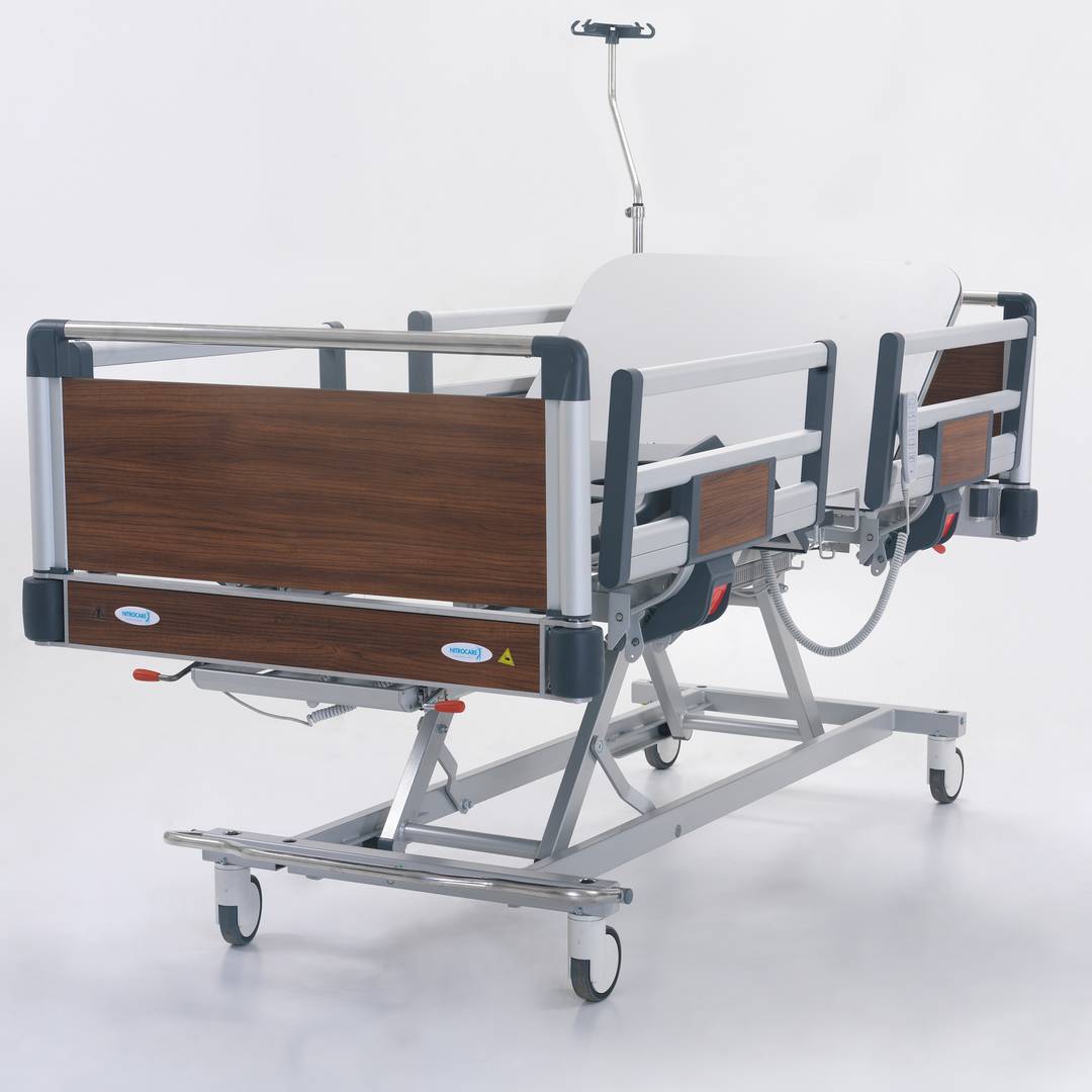 Four motor Nitrocare HB 4230 patient hospital bed with ABS lying surface