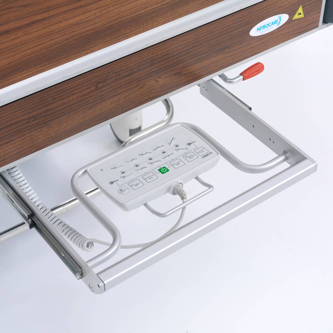 Four motor Nitrocare HB 4230 patient hospital bed with ABS lying surface