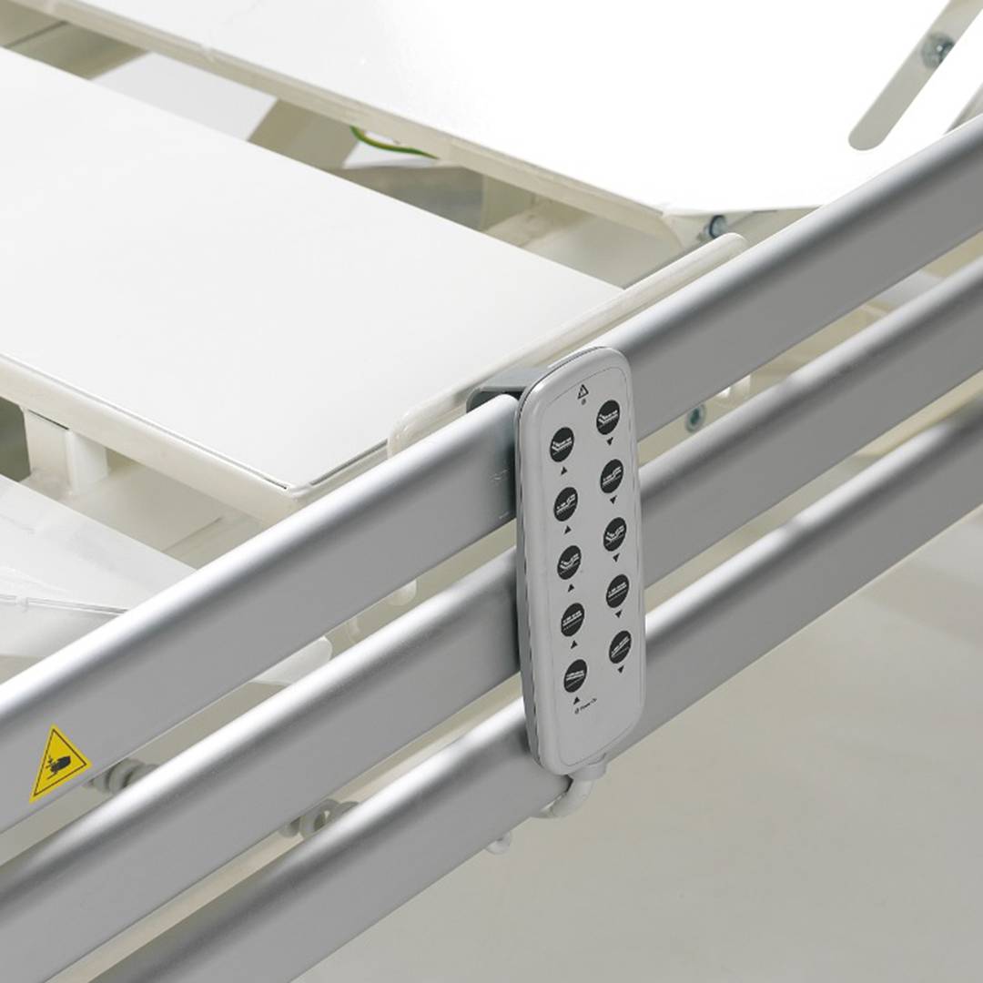 Four-motor Nitrocare HB 6630 patient hospital bed with metal lying surface