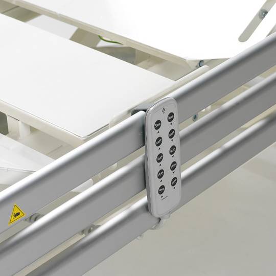 Four-motor Nitrocare HB 6630 patient hospital bed with metal lying surface