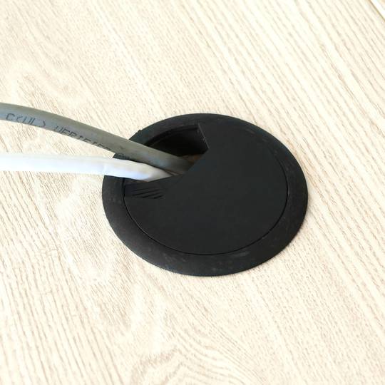 Set of 20 round cable grommets to build in table of black color and diameter 53 mm